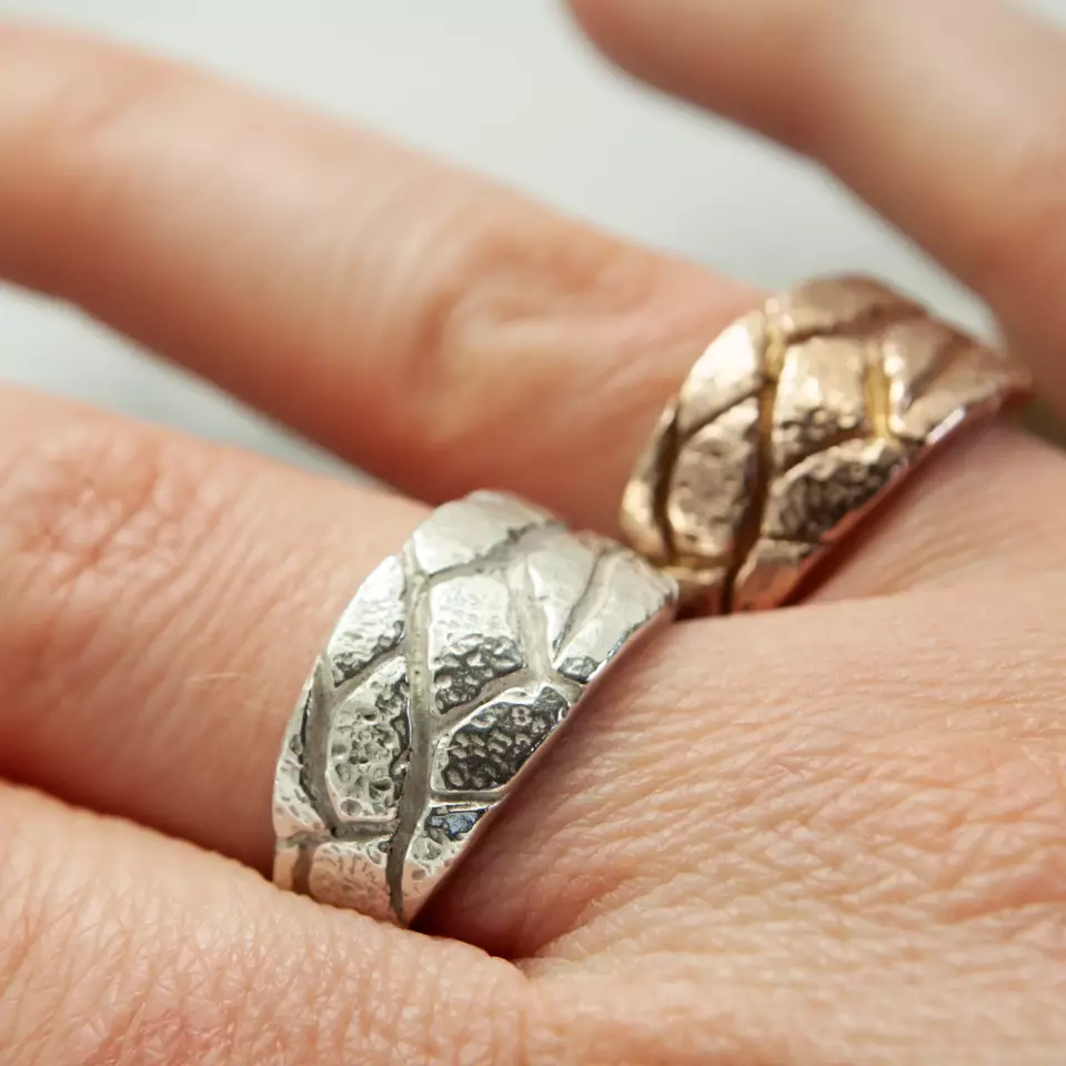 tree bark signet wedding rings on finger silver and rose gold plated silver rings