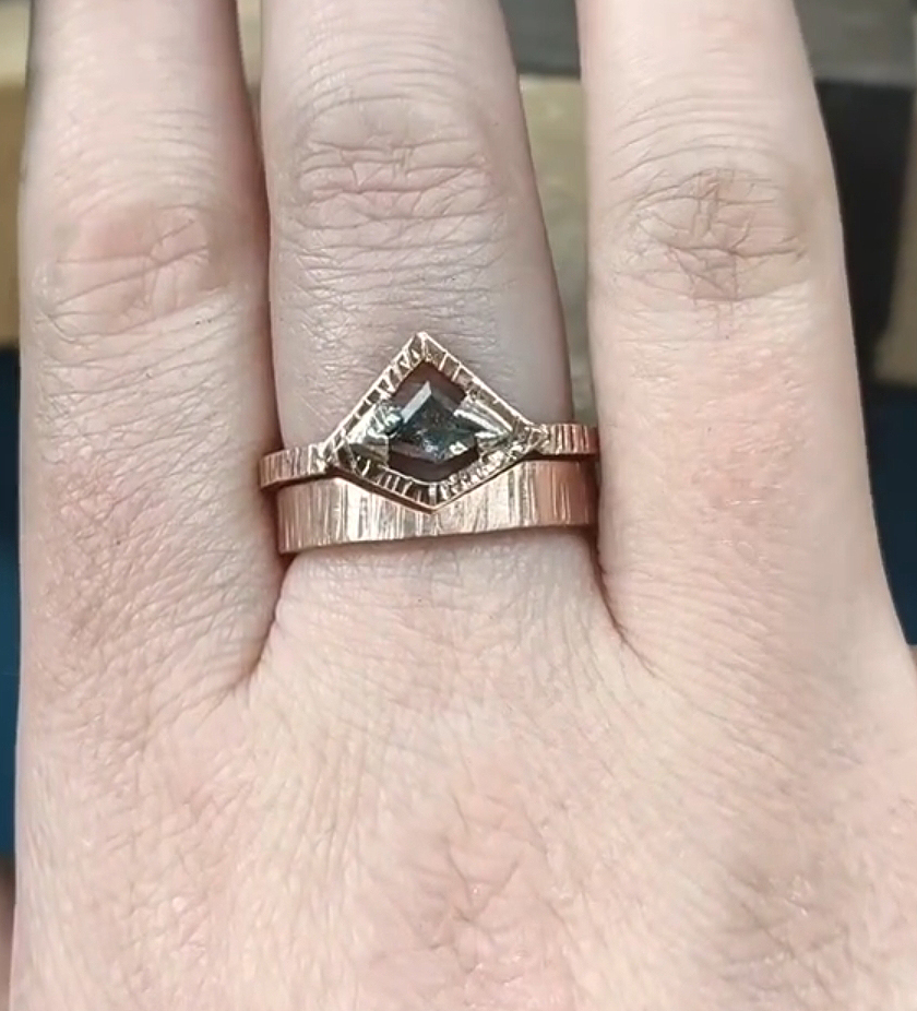9ct rose gold engagement ring with salt and pepper diamond and fitted wedding ring worn together on the finger