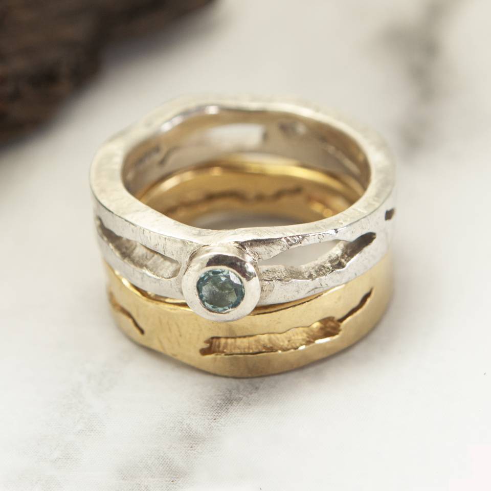 wave wedding and engagement rings silver blue topaz on top and gold plated silver wave wedding ring on bottom