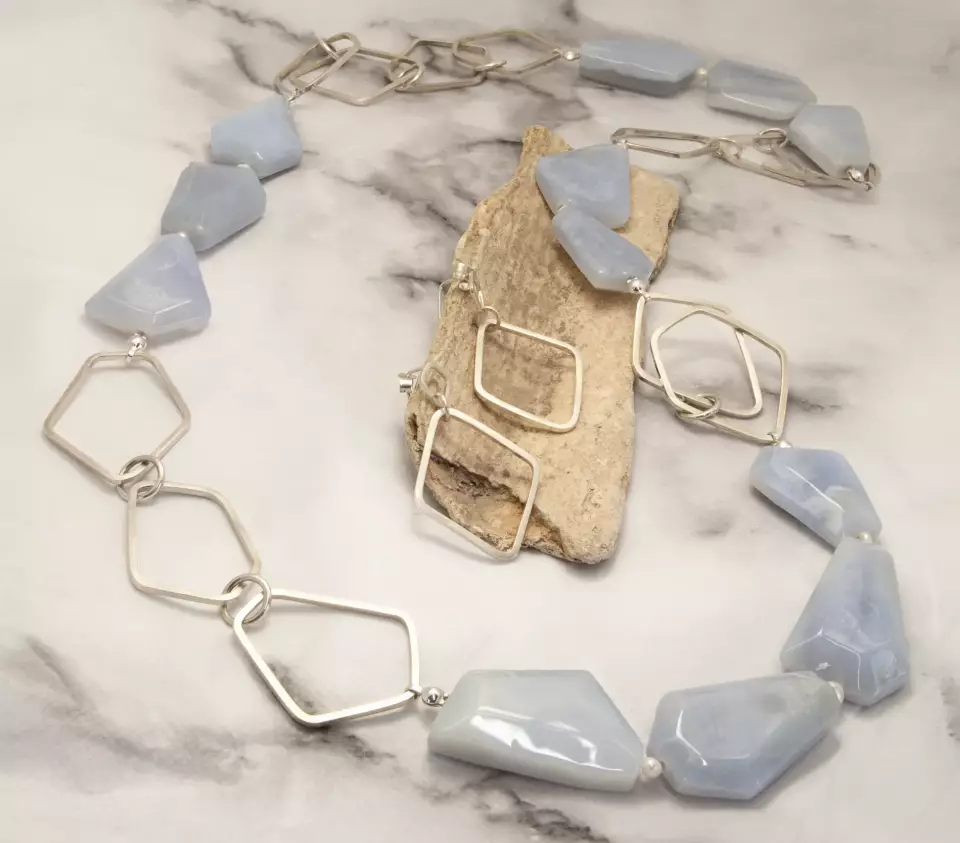 chalcedony necklace with pearls and hex shaped silver links on found objects from the beach showing full length of necklace